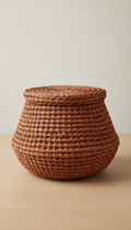 Woven textile basket in clay hue